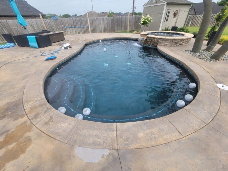 Free form pool with water feature in NWA - BC Pools